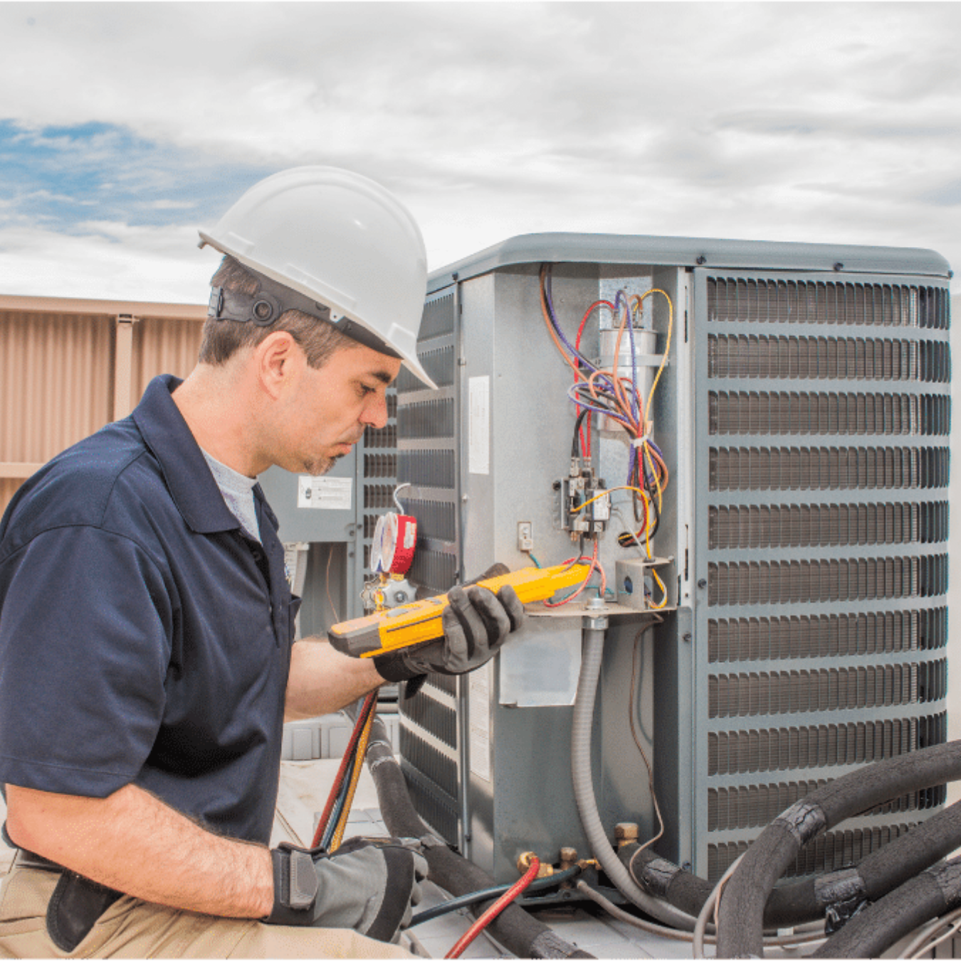 Leamington Heating & Cooling HVAC technician servicing a system
